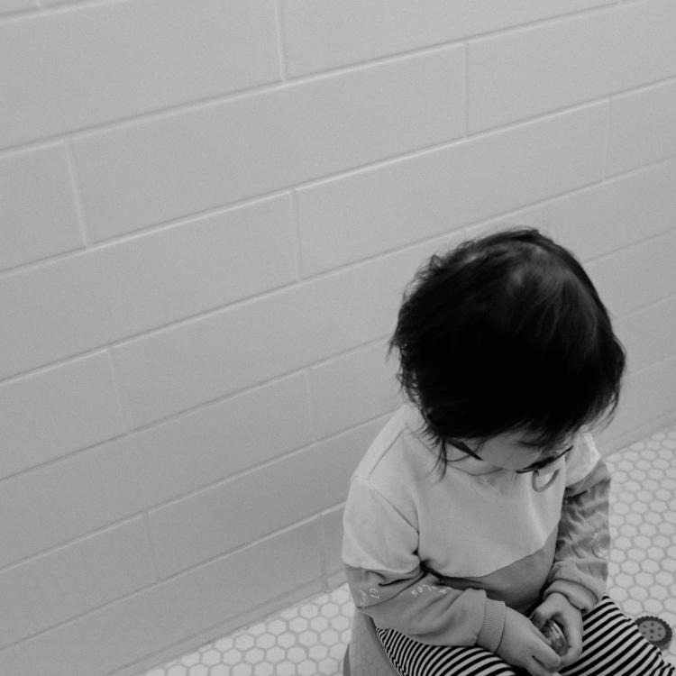 Child sitting on toilet