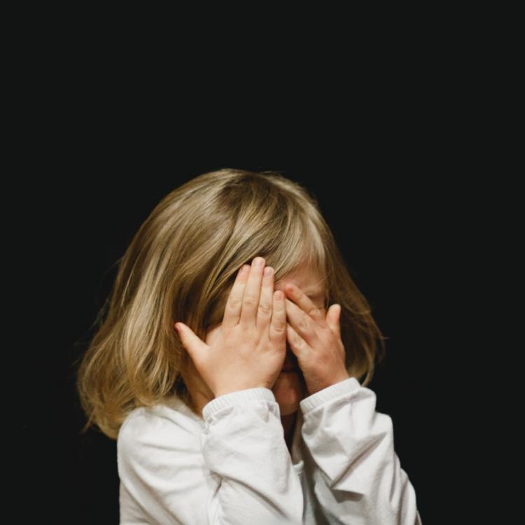 Child covering face